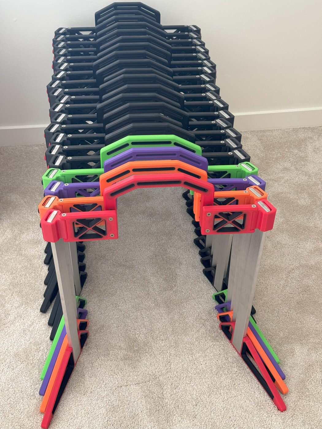 Batch of LAN Stand units in green, orange, purple and red colorways